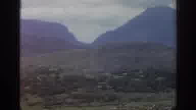 Ireland (1961): Slow Pan Of Greenish Scrubby Hills With A Large River Flowing