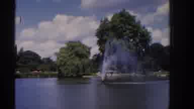 Ireland (1961): Water Fountain And Person Watching Duck Swimming In Park Pond