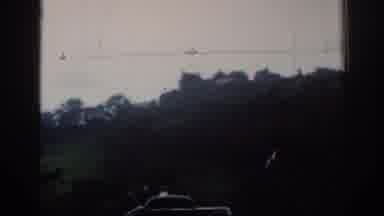 London England (1961): A Car And Three People Stopped In Front Of An Old Castle
