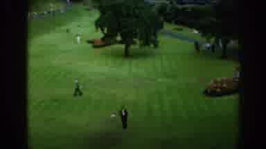 SCOTLAND-1961: A Group Of Golfers Practice Their Game On An Open Green Field