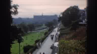 SCOTLAND-1961: People Strolling Park Grounds Beneath An Old Castle