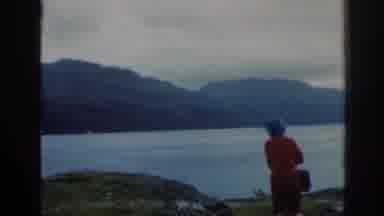 Scotland (1961): Old Footage Of A Woman Standing Near A Lake In A Hilly Area