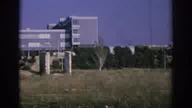 SPAIN-1966: Viewing An Old Red Building In A Grassy Field