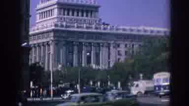 Spain (1966): Fast Moving Traffic Amid A Large City Taken Several Decades Ago
