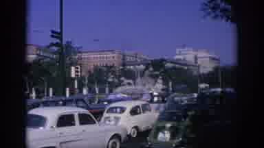 Spain (1966): Riding In A Car On A Busy Street Filled With Automobiles And Busses