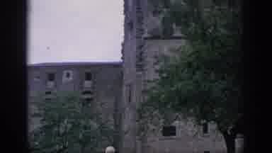 SPAIN-1966: Old Stone Castle With Medieval Architecture And Tree Cover