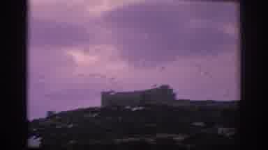 Spain (1966): Camera Filming Building Through Wet Train Window