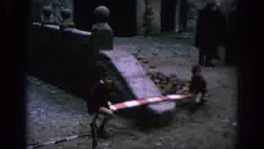 Spain (1966): Kids Find Fun Using A Board For A Seesaw In The Cobblestone