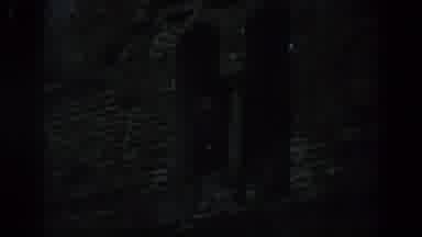 Spain (1966): Darkness Tall White Tower Behind Green Trees Light Post Daylight