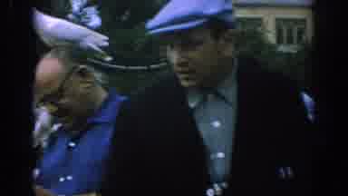 Spain (1966): Doves Swarm Older Men Who Seem Unphased (Against Their Better