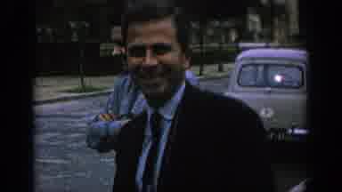 Spain (1966): A Clock Tower, And A Man Waving In Front Of A Car