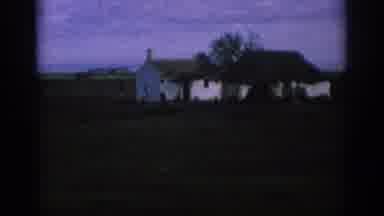 Spain (1966): Passing By An Old Style White Farmhouse With A Tree In The Front Out