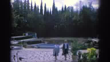 Spain (1966): A Garden With A Fountain And Two Woman Walking On Sand