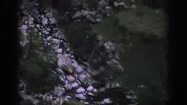 Spain (1966): An Aerial View Of A Train Tracks Going Through A Mountain Valley