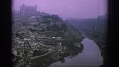 Spain (1966): A Large Town Of Houses Sitting By A River On A Hill