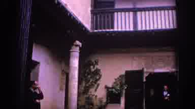 Spain (1966): A House With People Standing Outside Talking To Each Other