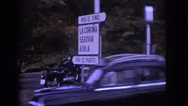 Spain (1966): Bus Passes Signs And Other Cars In Spain From The Point Of View Of A