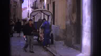 Spain (1966): People Walking Down Street In Italy With Cart And Then Shot Of Cars