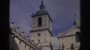 SPAIN-1966: Historic Bell Tower And Classic Cars On City Street