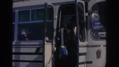 Spain (1966): An Adult Man Waiting As People Depart A Buss