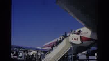 SPAIN-1966: Elegant Passengers Board TWA StarStream Airline