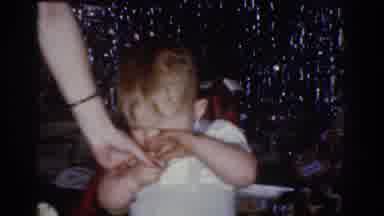 Omaha Nebraska USA (1968): Upset Baby Pushed By Hand Towards Red Tricycle In Small