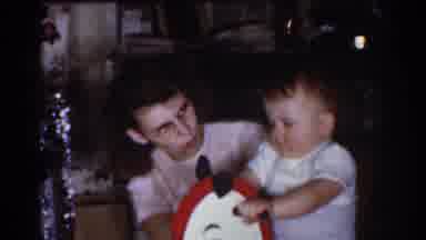 Omaha Nebraska USA (1968): A Woman Playing With A Child Riding A Rocking Horse