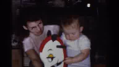 Omaha Nebraska USA (1968): Baby Rides White Horse Rocker Inserts Small Pacifier