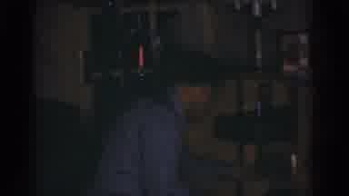 Omaha Nebraska USA (1968): A Man Working On Technological Device In A Dark Room