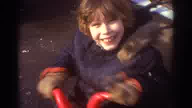 Bedford Virginia USA (1971): Child Playing Outside On A Tricycle On A Cold Day