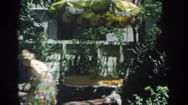 Miami Florida USA (1971): Woman In A Summer Dress Putting Something On The Floor