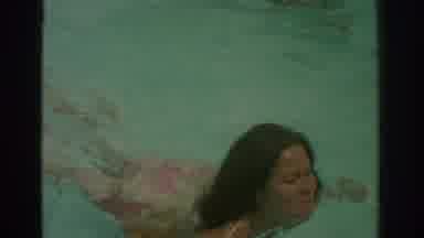 Miami Florida USA (1971): A Woman, In A Bikini, And Young Children Swimming In A