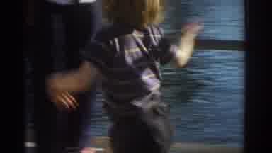 Miami Florida USA (1971): Small Boy Wearing Shorts Running On Pier Platform In
