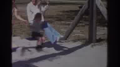 Miami Florida USA (1971): Family Swinging On Swings At The Park Outside On A Nice