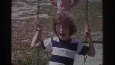 Miami Florida USA (1971): Kids On Swings Being Pushed By Friends