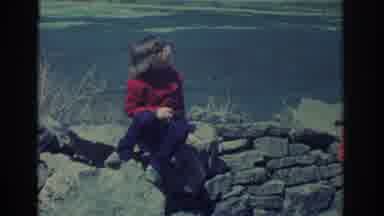 Niagra Falls New York USA (1971): Young Child In Glasses And A Sweater Talks To An