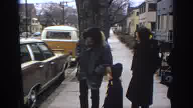 Philadephia Pennsylvania USA (1972): A Family Looking At A Car On A City Street