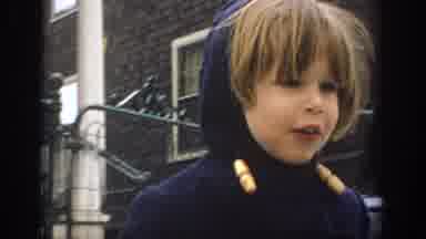 Philadephia Pennsylvania USA (1972): Child In A Blue Coat Watching Their Breath In