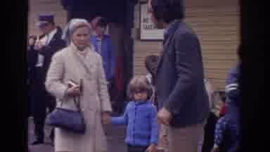 Philadephia Pennsylvania USA (1972): A Family And Their Child Carefully Step Over