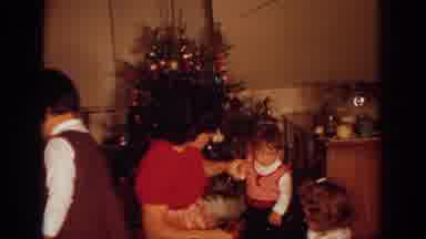 Philadephia Pennsylvania USA (1972): Mother Stops Young Child From Grabbing Item