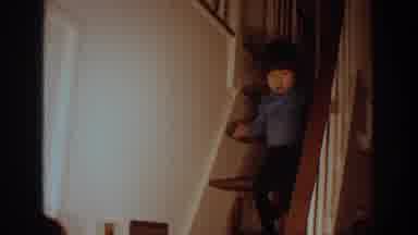 Philadephia Pennsylvania USA (1972): Young Boy Carefully Walks Down Stairs Towards