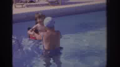 Philadephia Pennsylvania USA (1972): Woman Happily Plays With Child In Home Pool