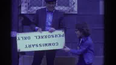 Toronto Canada (1972): A Man And A Child In An Old Video With A Sign In A Small