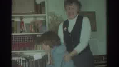 Toronto Canada (1972): Older Woman Playfully Holding Back A Young Boy Who Is