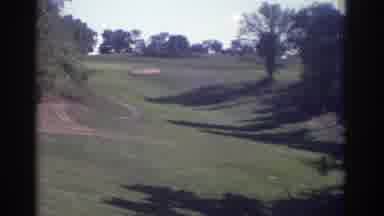 Toronto Canada (1972): A Man Walking Waves Followed By A View Of A Sand Trap On A