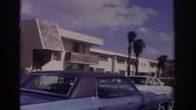 Naples Florida USA-1973: View Of White Buildings And Parking Lot In Tropical