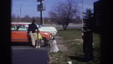 Philadelphia Pennsylvania USA (1973): Woman Takes Picture Of Man With Child In