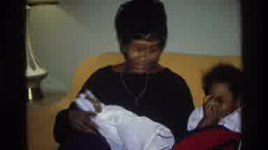 Atlanta Georgia USA (1975): A Woman Sits With A Young Girl And Holds And Cuddles