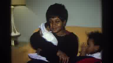 Atlanta Georgia USA (1975): Black Woman Holding Doll With Child Next To Her