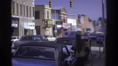 Atlanta Georgia USA (1975): One Person Open The Car Door In The Road And Some